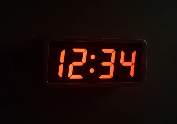 Retro 7-segment digital clock on a dark background