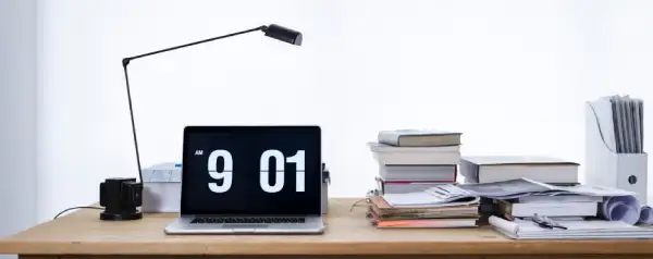 Full-screen digital clock in an office or public space for visibility.